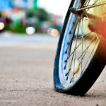 An,Old,Bike,That,Has,Back,Flat,Tire,Parked,By