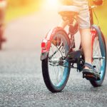 Children,On,A,Bicycle,At,Asphalt,Road,In,Early,Morning