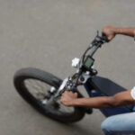 Top,View,Of,Young,Man,Riding,Electric,Bike,Along,The